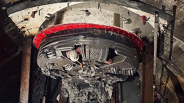 View into a launch shaft showing the cutterhead of a tunnel boring machine during construction of the DTSS Sewers