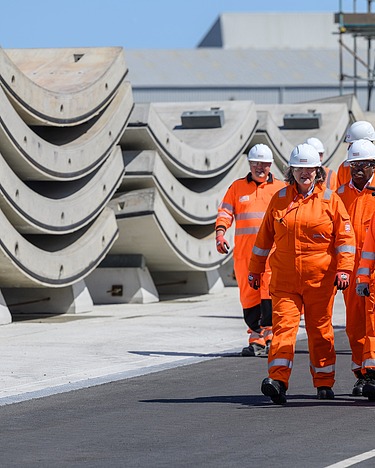 STRABAG factory Hartlepool Six workers walk next to precast concrete elements