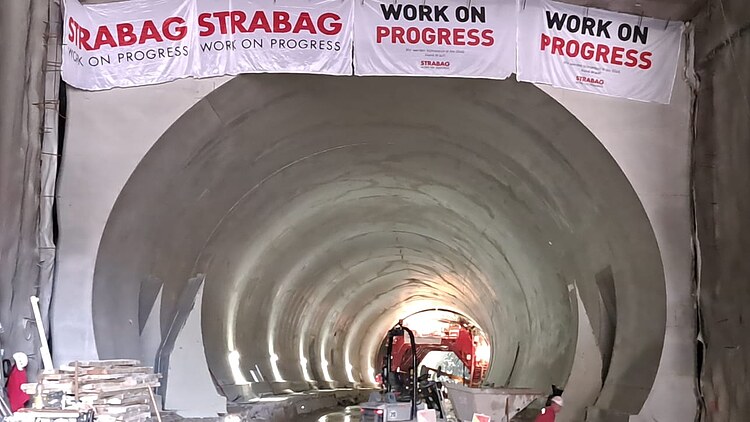 Konovo Tunnel tube with STRABAG flags and construction materials