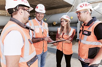 Image of four members of the construction team